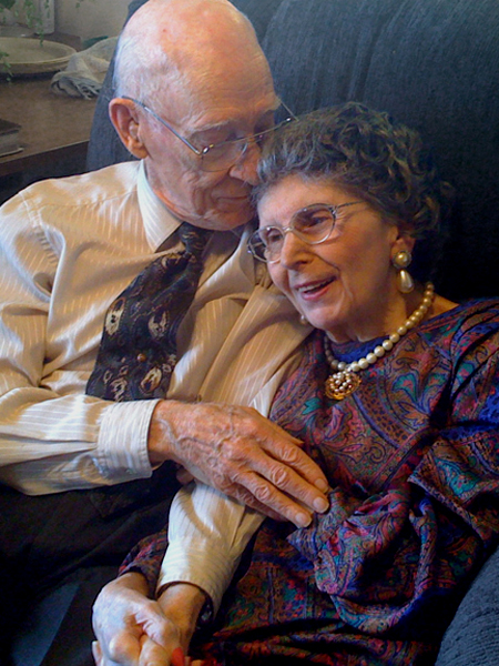 JV and Ele cuddling in chair at 89 years old, Eleanor with advanced Parkinsons and Alzheimers
