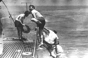 Herbert (Doc) Starmer climbs aboard after helping to rescue bombardier Gareth (Rocky) Clift from the ocean--Courtesy of the Wisconsin Maritime Museum, see LINKS below for more.